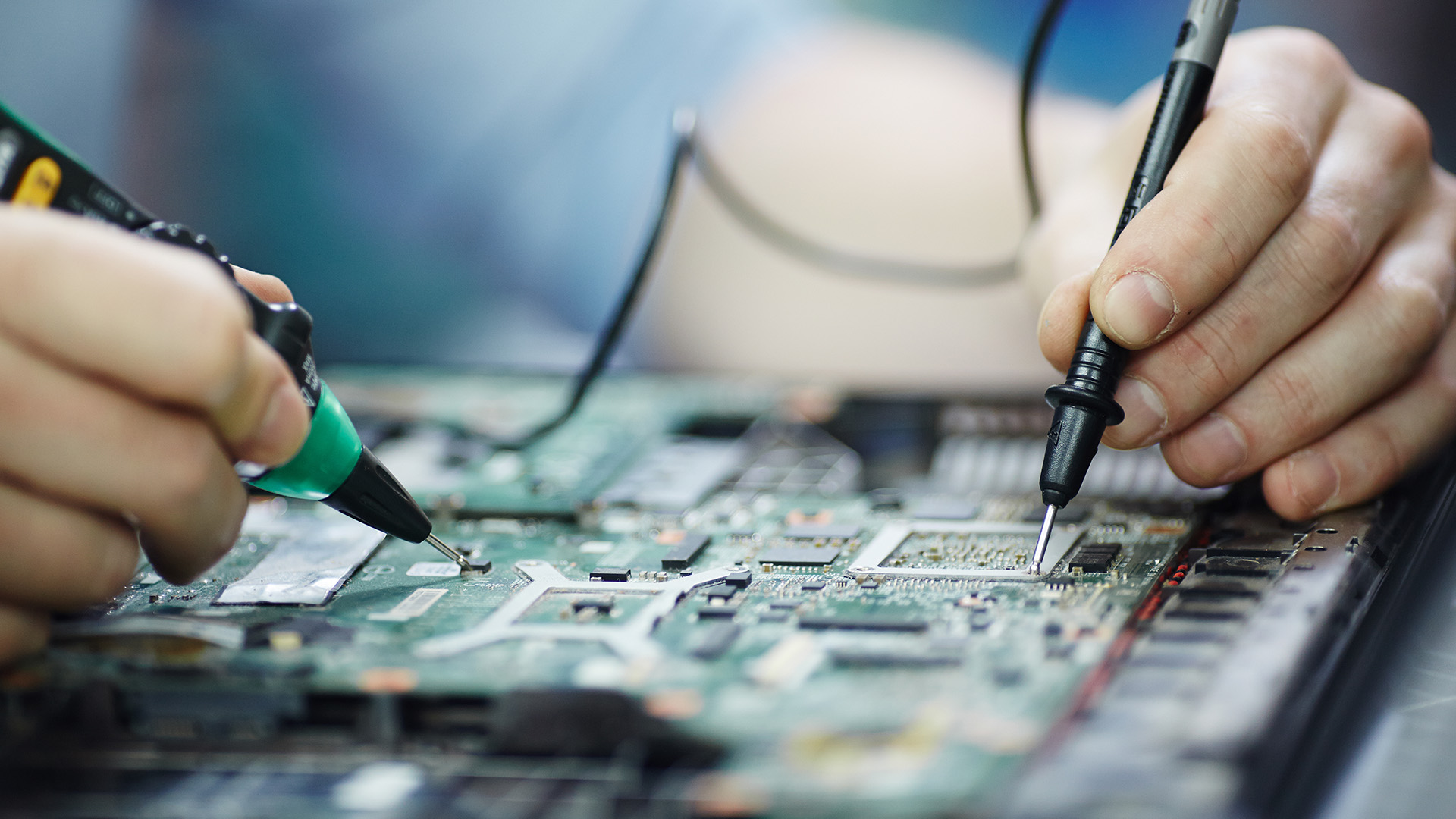Person fixing a Circuit Board