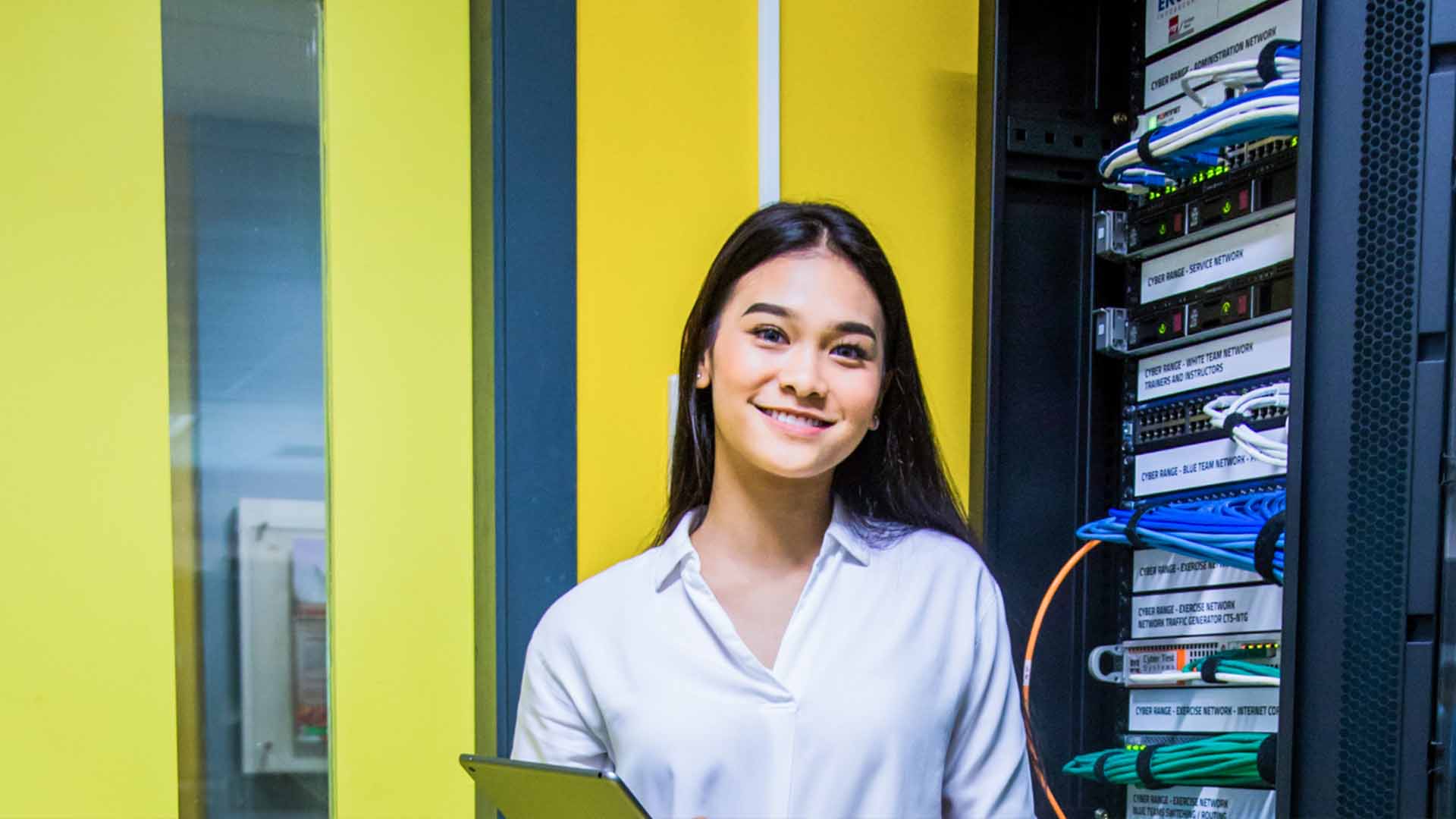 Girl Smiling in Front of Server